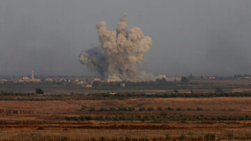 Smoke can be seen following an explosion at the Syrian side of the Israeli-Syrian border as it is seen from the Israeli-occupied Golan Heights